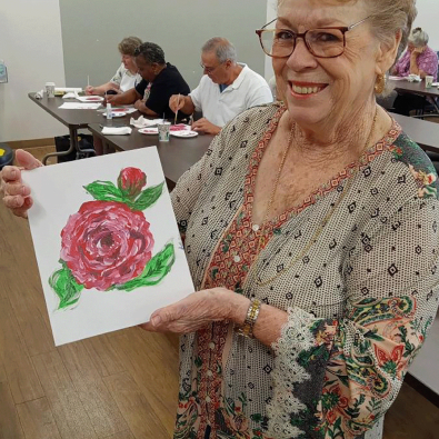 Post Photo Example. Image of a person holding a drawing of flowers.